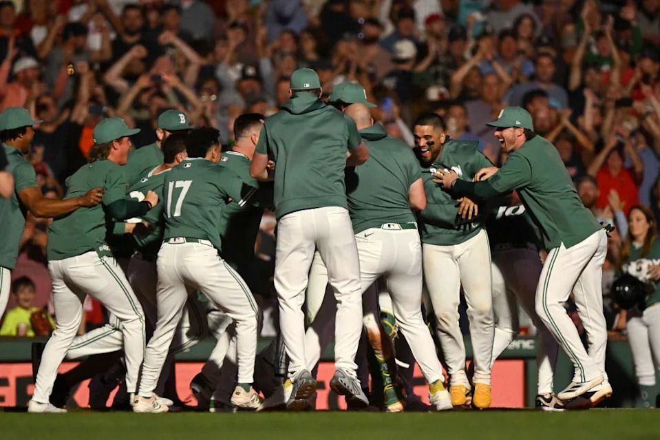 The Boston Red Sox celebrate after Ceddanne Rafaela hit a walk-off RBI triple to defeat the Detroit Tigers during the ninth inning at Fenway Park on September 26, 2025 in Boston, Massachusetts. Getty Images