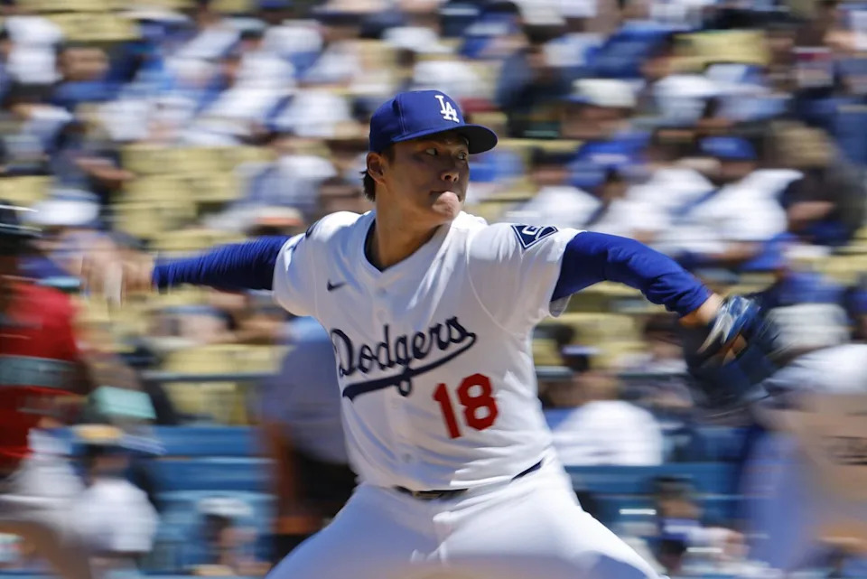 Dodgers pitcher Yoshinobu Yamamoto delivers during the fourth inning Sunday against the Diamondbacks.