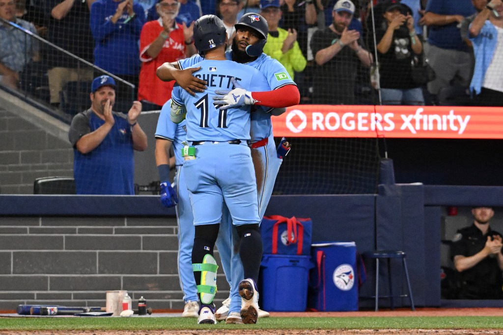 Bo Bichette and Vladimir Guerrero Jr. celebrating a home run.