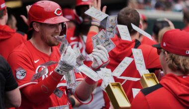 Cincinnati Reds' Tyler Stephenson, left, celebrates his grand slam against the Detroit Tigers in the fifth inning during a baseball game, Saturday, June 14, 2025, in Detroit. (AP Photo/Paul Sancya)