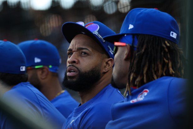 Newly-acquired player Carlos Santana watches from the dugout in the fourth inning against the Braves at Wrigley Field on Sept. 1, 2025, in Chicago. (John J. Kim/Chicago Tribune)