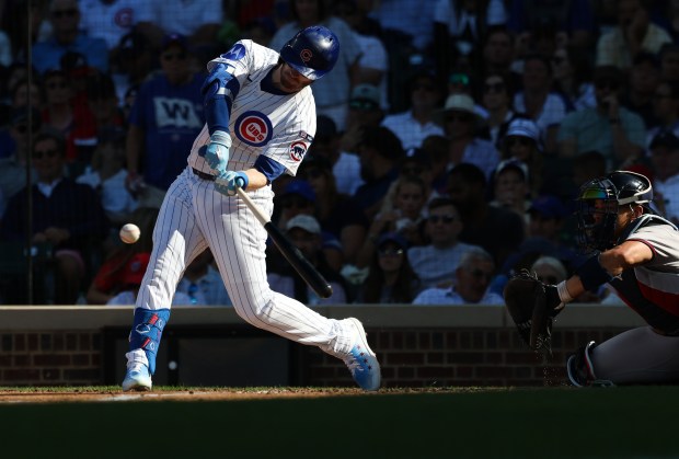 Cubs left fielder Ian Happ swings for a solo home run in the fourth inning against the Braves at Wrigley Field on Sept. 1, 2025, in Chicago. (John J. Kim/Chicago Tribune)