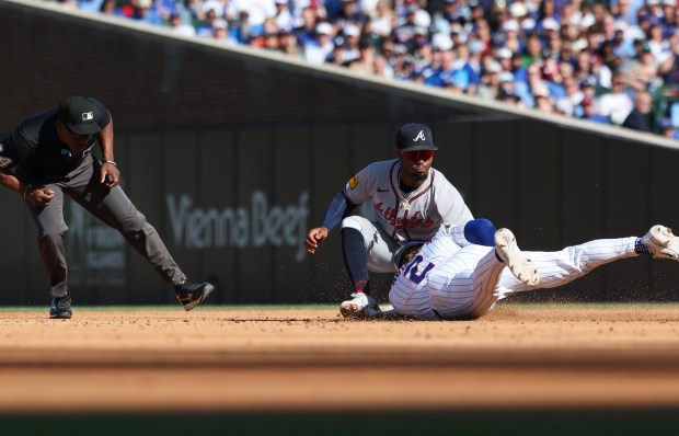 Cubs second baseman Nico Hoerner (2) is picked off by Braves second baseman Ozzie Albies in the fourth inning at Wrigley Field on Sept. 1, 2025, in Chicago. (John J. Kim/Chicago Tribune)
