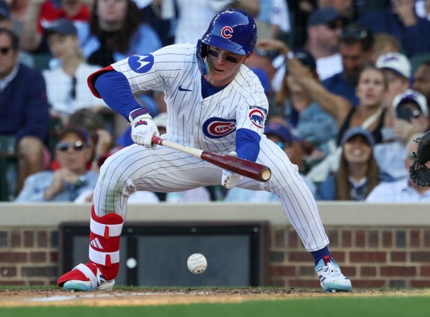 Cubs center fielder Pete Crow-Armstrong bunts for a single against the Braves in the sixth inning at Wrigley Field on Sept. 1, 2025, in Chicago. (John J. Kim/Chicago Tribune)