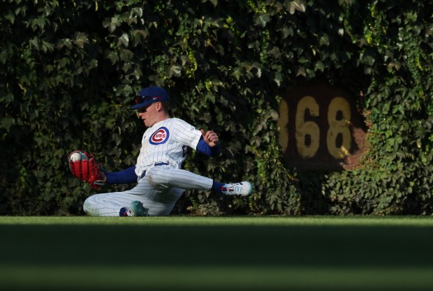 Cubs center fielder Pete Crow-Armstrong slides while catching a liner from Braves second baseman Ozzie Albies for an out in the seventh inning at Wrigley Field on Sept. 1, 2025, in Chicago. (John J. Kim/Chicago Tribune)
