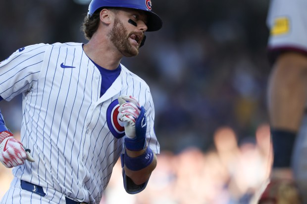Cubs catcher Carson Kelly rounds the bases after hitting a game-tying, two-run home run against the Braves the eighth inning at Wrigley Field on Sept. 1, 2025, in Chicago. (John J. Kim/Chicago Tribune)