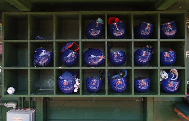 Cubs players' helmets are placed in shelves before a game against the Cardinals at Wrigley Field on Sept. 27, 2025, in Chicago. (John J. Kim/Chicago Tribune)