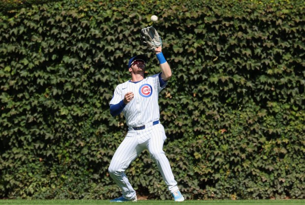 Cubs left fielder Ian Happ catches a fly ball from Cardinals first baseman Alec Burleson for an out in the first inning at Wrigley Field on Sept. 27, 2025, in Chicago. (John J. Kim/Chicago Tribune)