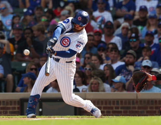 Cubs first baseman Michael Busch connects for a double in the third inning against the Cardinals at Wrigley Field on Sept. 27, 2025, in Chicago. (John J. Kim/Chicago Tribune)