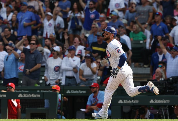 Cubs first baseman Michael Busch rounds the bases after hitting a two-run home run against the Cardinals in the fifth inning at Wrigley Field on Sept. 27, 2025, in Chicago. (John J. Kim/Chicago Tribune)