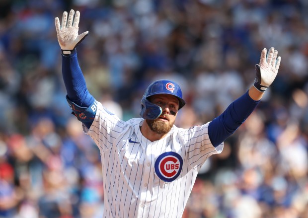 Cubs first baseman Michael Busch rounds the bases after hitting a two-run home run against the Cardinals in the fifth inning Sept. 27, 2025, at Wrigley Field. (John J. Kim/Chicago Tribune)