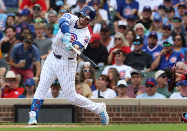Cubs left fielder Ian Happ connects for a single against the Cardinals in the fifth inning at Wrigley Field on Sept. 27, 2025, in Chicago. (John J. Kim/Chicago Tribune)