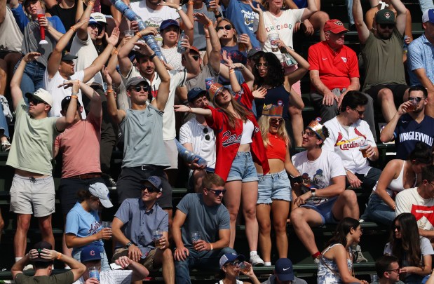 Fans dance during a pitching change in the fifth inning of a Cubs-Cardinals game at Wrigley Field on Sept. 27, 2025, in Chicago. (John J. Kim/Chicago Tribune)
