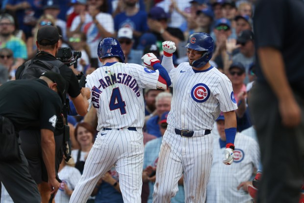 Cubs left fielder Pete Crow-Armstrong celebrates with right fielder Seiya Suzuki after hitting a two-run home run in the eighth inning against the Cardinals at Wrigley Field on Sept. 27, 2025, in Chicago. (John J. Kim/Chicago Tribune)