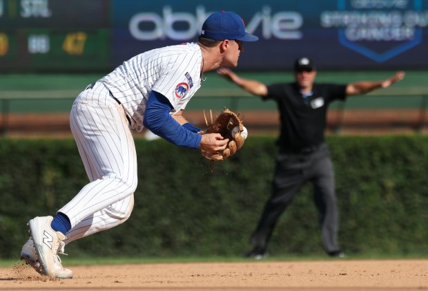 Cubs third baseman Matt Shaw fields a grounder from Cardinals second baseman Nolan Gorman, which gets stuck in the glove's web, resulting in a single for Gorman, in the ninth inning at Wrigley Field on Sept. 27, 2025, in Chicago. (John J. Kim/Chicago Tribune)