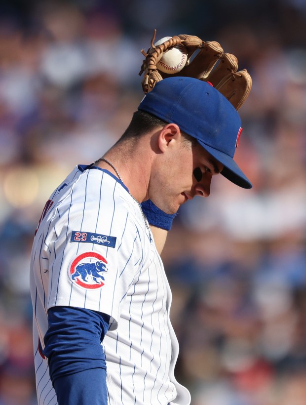A grounder hit by Cardinals second baseman Nolan Gorman remains stuck in Cubs third baseman Matt Shaw's glove web, resulting in a single for Gorman, in the ninth inning at Wrigley Field on Sept. 27, 2025, in Chicago. (John J. Kim/Chicago Tribune)