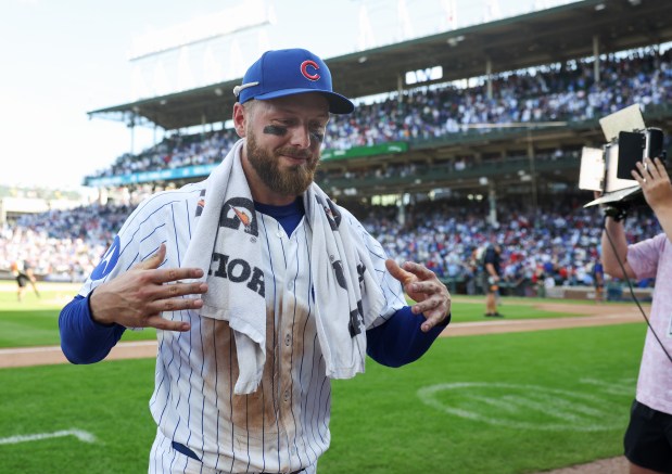 Cubs first baseman Michael Busch heads for the clubhouse following an interview after a 7-3 win over the Cardinals at Wrigley Field on Sept. 27, 2025, in Chicago. (John J. Kim/Chicago Tribune)