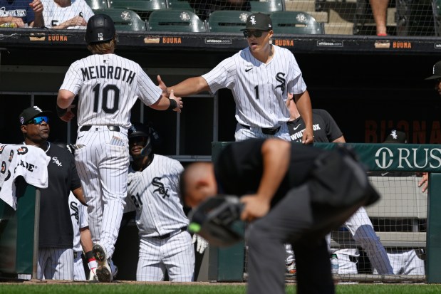 White Sox second baseman Chase Meidroth (10) celebrates with manager Will Venable after scoring on a Colson Montgomery single in the first inning against the Rays on Thursday, Sept. 11, 2025, at Rate Field. (AP Photo/Paul Beaty)