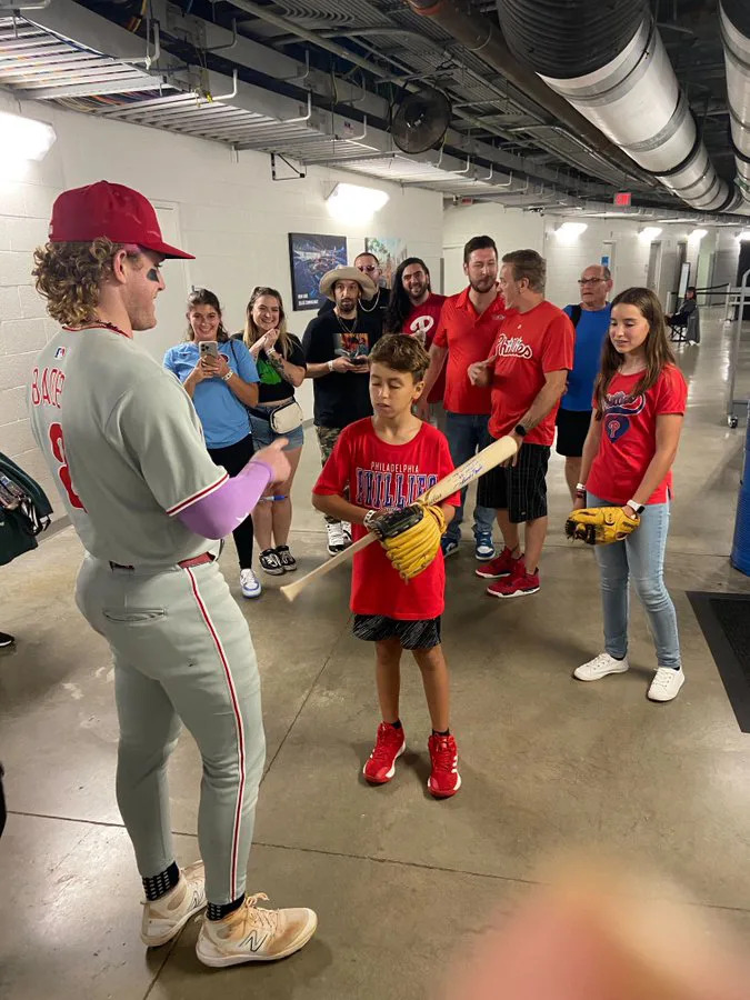 Phillies outfielder Harrison Bader signed a bat for the kid after the game. Philadelphia Phillies/X