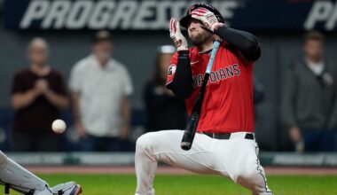 Cleveland Guardians' David Fry falls back after being hit in the face by a pitch in the sixth inning of a baseball game against the Detroit Tigers in Cleveland, Tuesday, Sept. 23, 2025. (AP Photo/Sue Ogrocki)