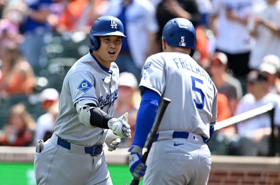 Shohei Ohtani celebrates a home run with Freddie Freeman.