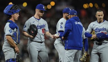 Los Angeles Dodgers pitcher Jack Dreyer, second from left, hands the ball over to manager Dave Roberts as he exits during the ninth inning of a baseball game against the San Francisco Giants, Friday, Sept. 12, 2025, in San Francisco. (AP Photo/Godofredo A. Vásquez)