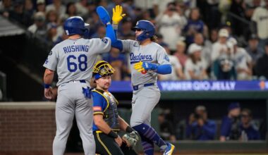 Los Angeles Dodgers' Kiké Hernandez (8) celebrates with Dalton Rushing (68) after hitting a two-run home run to score Rushing during the third inning of a baseball game against the Seattle Mariners, Friday, Sept. 26, 2025, in Seattle. (AP Photo/Ryan Sun)