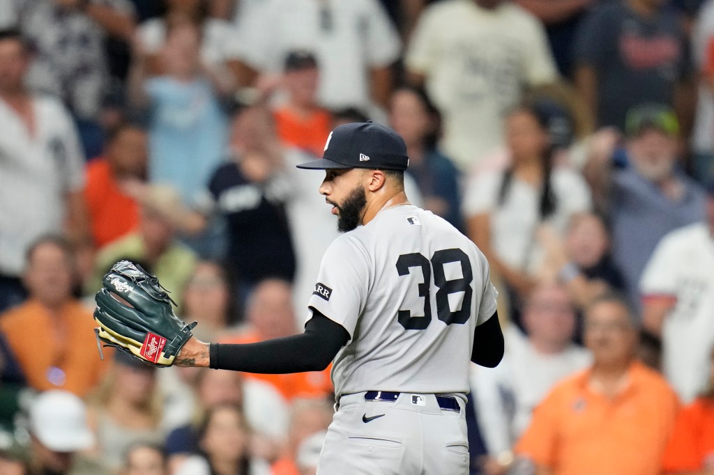Devin Williams, New York Yankees pitcher #38, walking off the field.