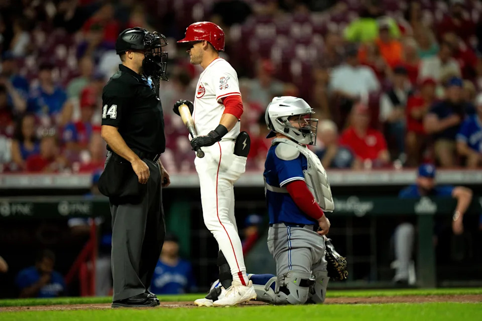 Cincinnati Reds center fielder TJ Friedl speaks to home plate umpire Mark Wegner in the fourth inning
