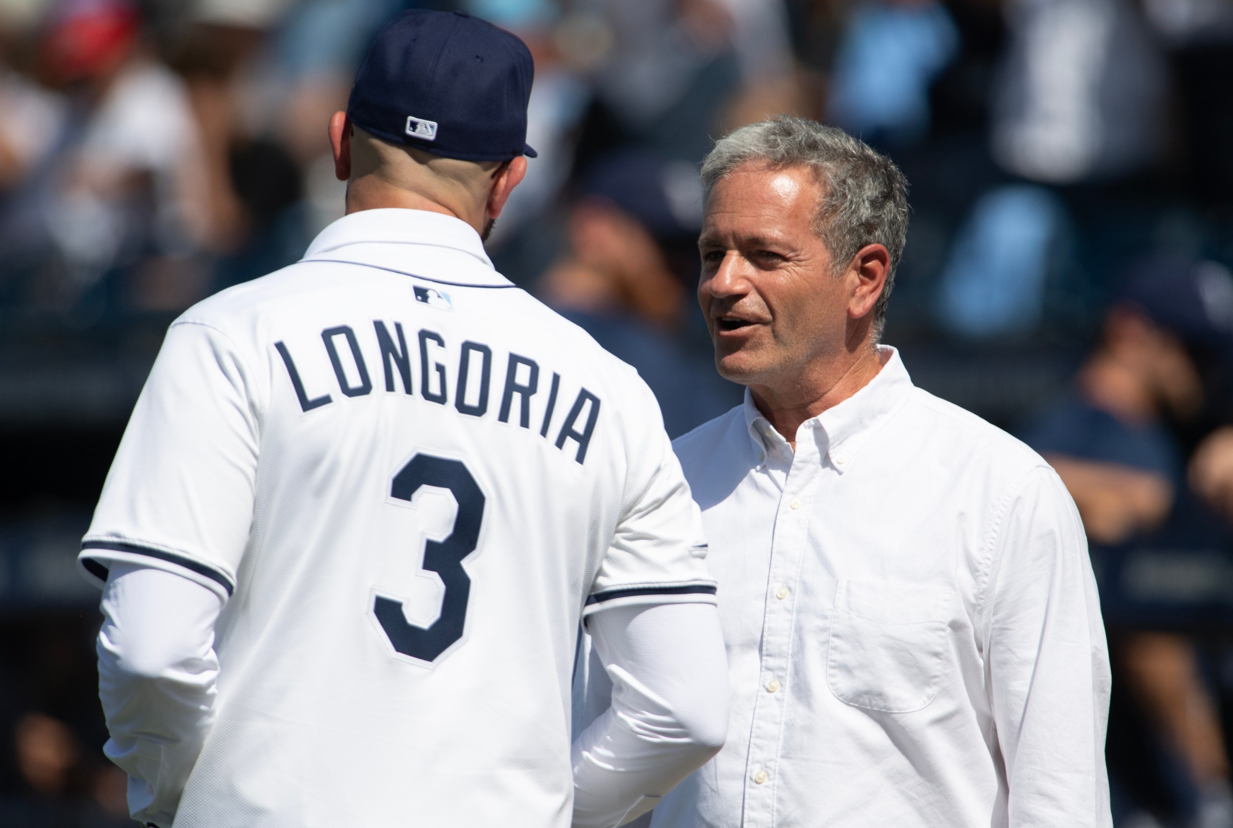 TAMPA, FLORIDA - JUNE 7: Tampa Bay Rays owner Stuart Sternberg, right, chats with Evan Longoria after the former Ray signed a one-day contract with the Tampa Bay Rays and officially retired at George M. Steinbrenner Field on June 7, 2025 in Tampa, Florida. (Photo by Mark Taylor/Getty Images)