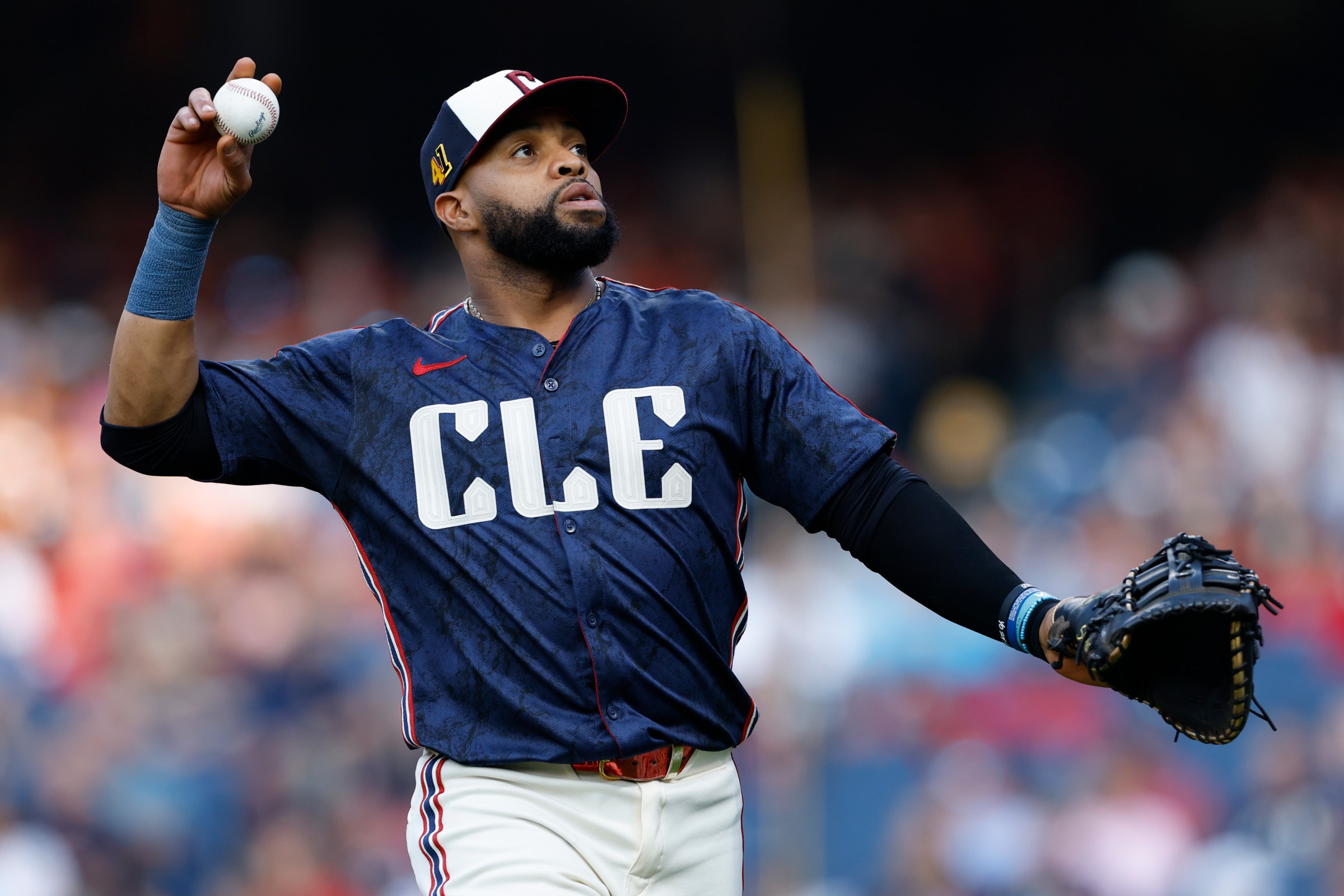 CLEVELAND, OH - AUGUST 15: Carlos Santana #41 of the Cleveland Guardians throws a ball into the crowd during the game between the Atlanta Braves and the Cleveland Guardians at Progressive Field on Friday, August 15, 2025 in Cleveland, Ohio. (Photo by Lauren Leigh Bacho/MLB Photos via Getty Images)