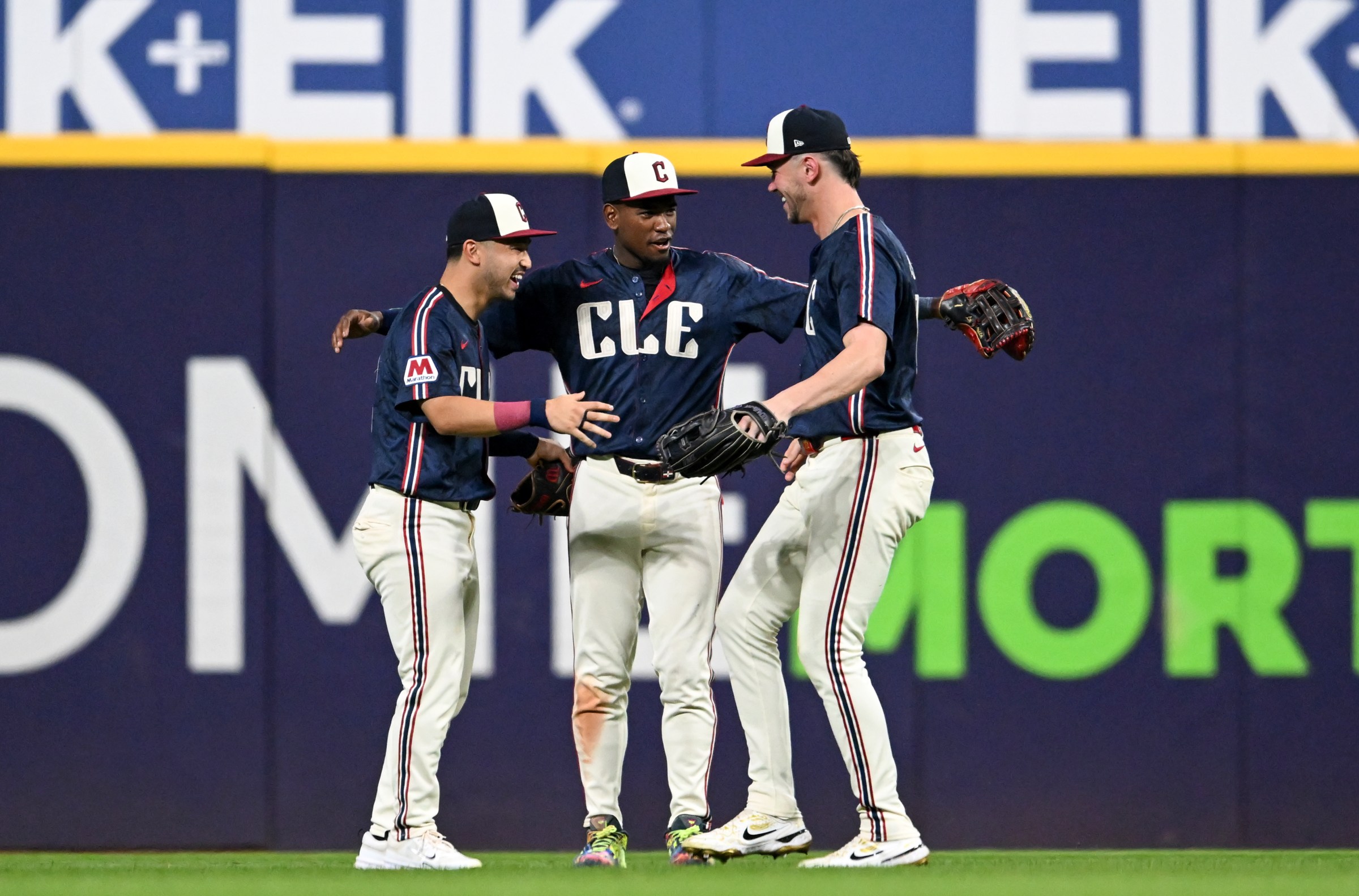 CLEVELAND, OHIO - SEPTEMBER 12: Steven Kwan #38, Angel Martínez #1 and Nolan Jones #22 of the Cleveland Guardians celebrate the team’s 4-0 win over the Chicago White Sox at Progressive Field on September 12, 2025 in Cleveland, Ohio. (Photo by Nick Cammett/Getty Images)