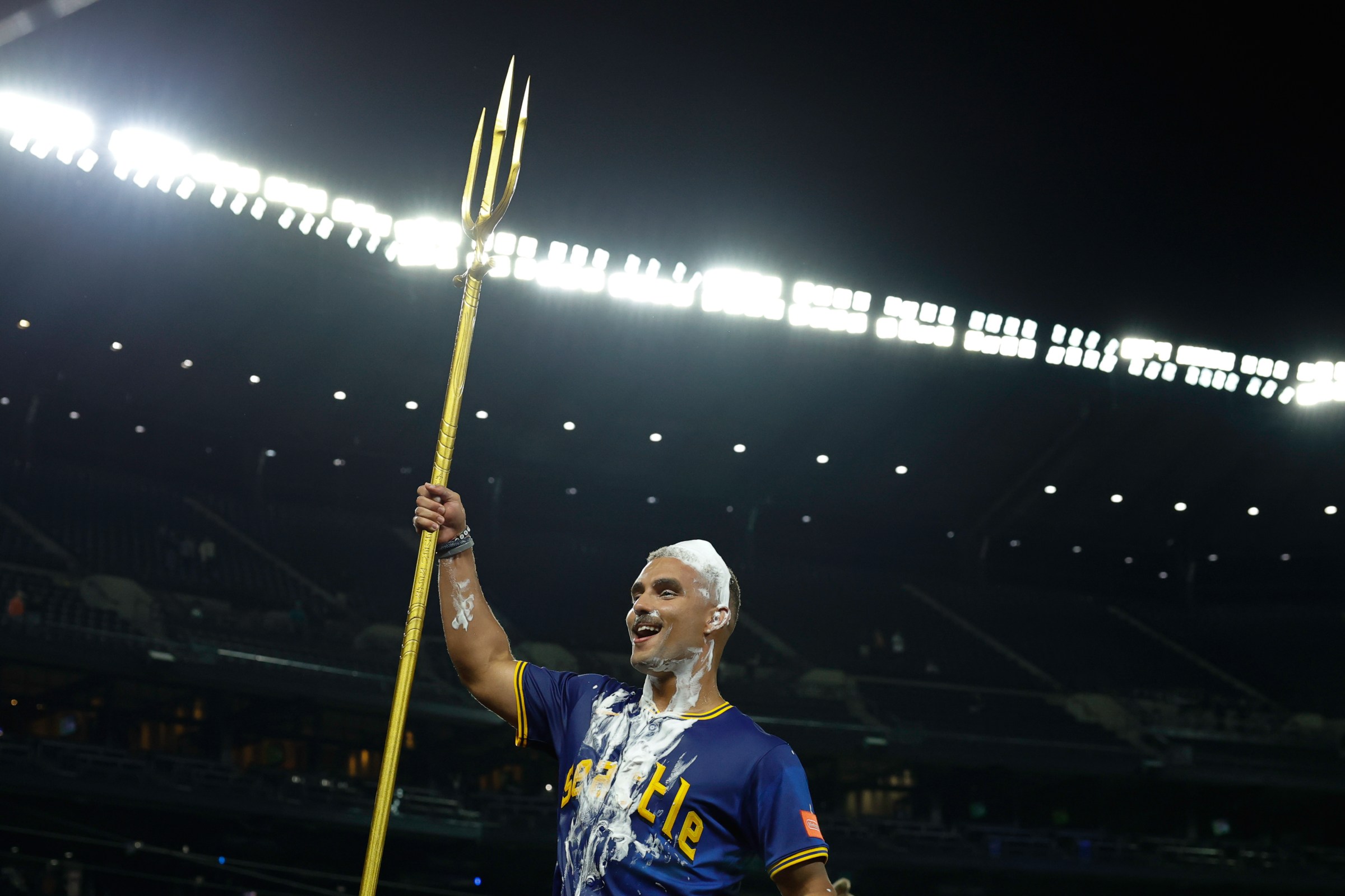 SEATTLE, WASHINGTON - SEPTEMBER 11: Harry Ford #5 of the Seattle Mariners raises the celebratory team trident after the game against the Los Angeles Angels at T-Mobile Park on September 11, 2025 in Seattle, Washington. The Seattle Mariners won 7-6 in 12 innings. (Photo by Alika Jenner/Getty Images)