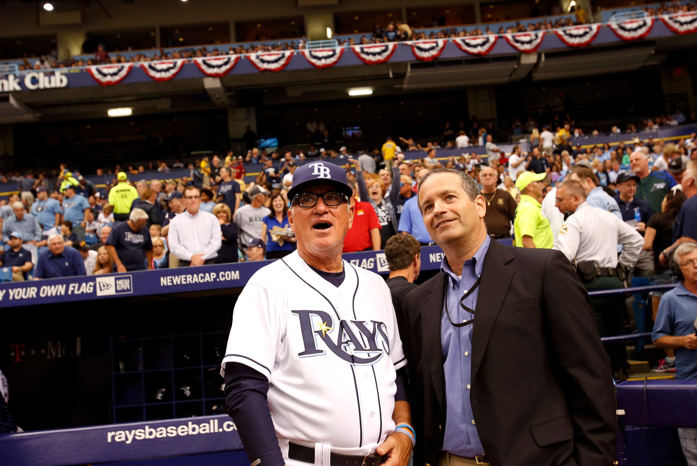 ST. PETERSBURG, FL - MARCH 31: Joe Maddon #70 of the Tampa Bay Rays (L) and Tampa Bay Rays Managing General Partner Stuart Sternberg look on as they raise their 2013 American League Wild Card banner during Opening Day ceremonies before the start of a game against the Toronto Blue Jays on March 31, 2014 at Tropicana Field in St. Petersburg, Florida. (Photo by Brian Blanco/Getty Images)
