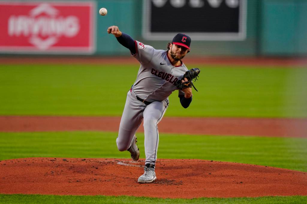 Cleveland Guardians pitcher throwing a baseball.