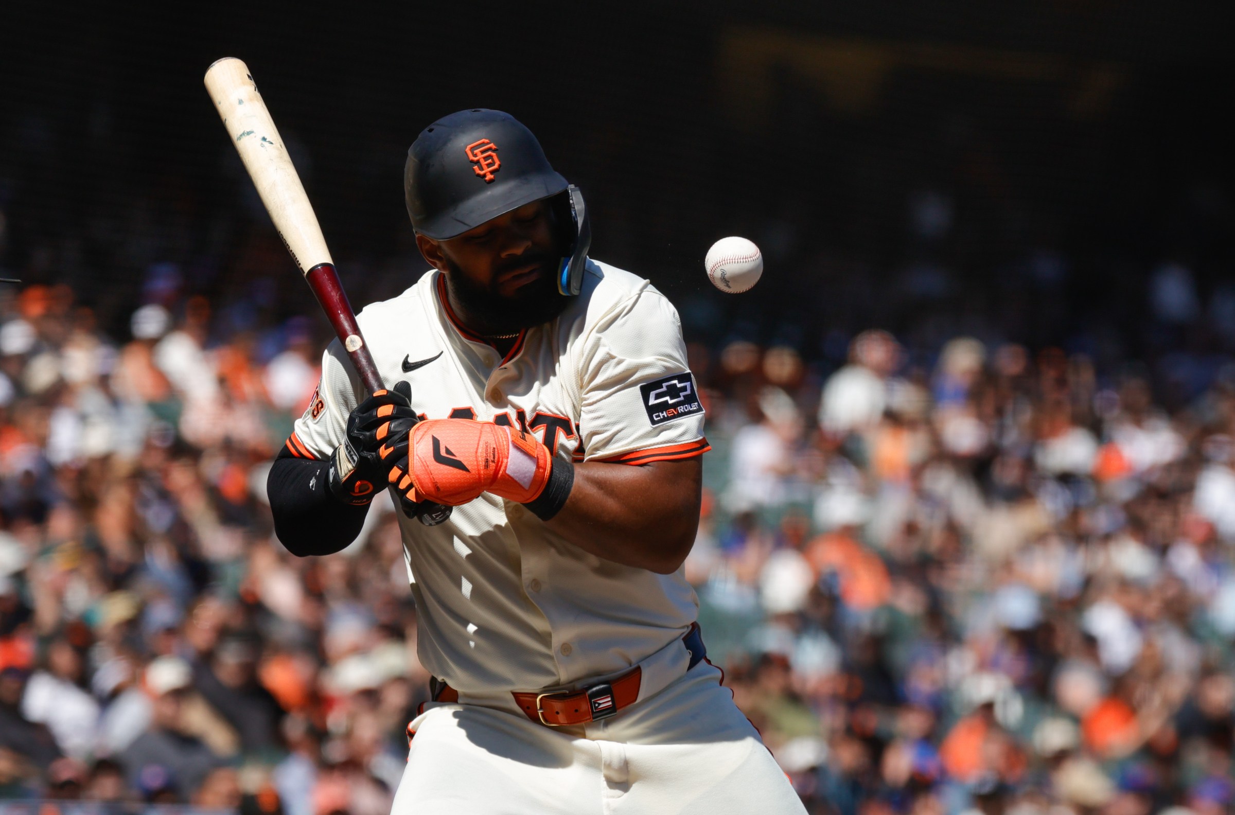 Aug 28, 2025; San Francisco, California, USA; San Francisco Giants left fielder Heliot Ramos (17) gets hit by a pitch during the eighth inning against the Chicago Cubs at Oracle Park. Mandatory Credit: Sergio Estrada-Imagn Images