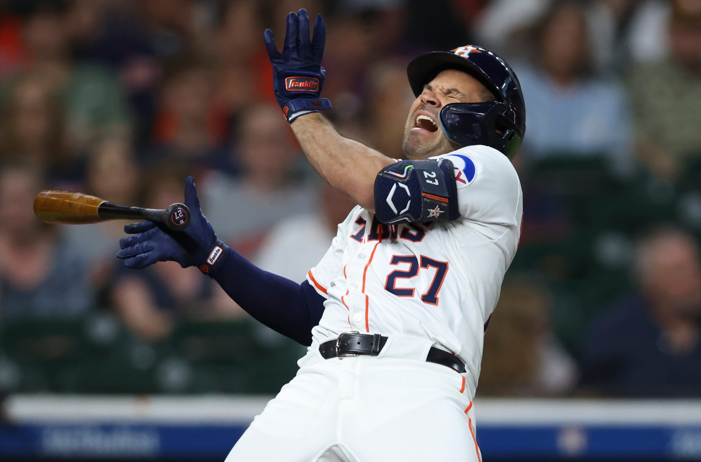 Aug 30, 2025; Houston, Texas, USA; Houston Astros second baseman Jose Altuve (27) reacts after being hit by a pitch during the first inning against the Los Angeles Angels at Daikin Park. Mandatory Credit: Troy Taormina-Imagn Images