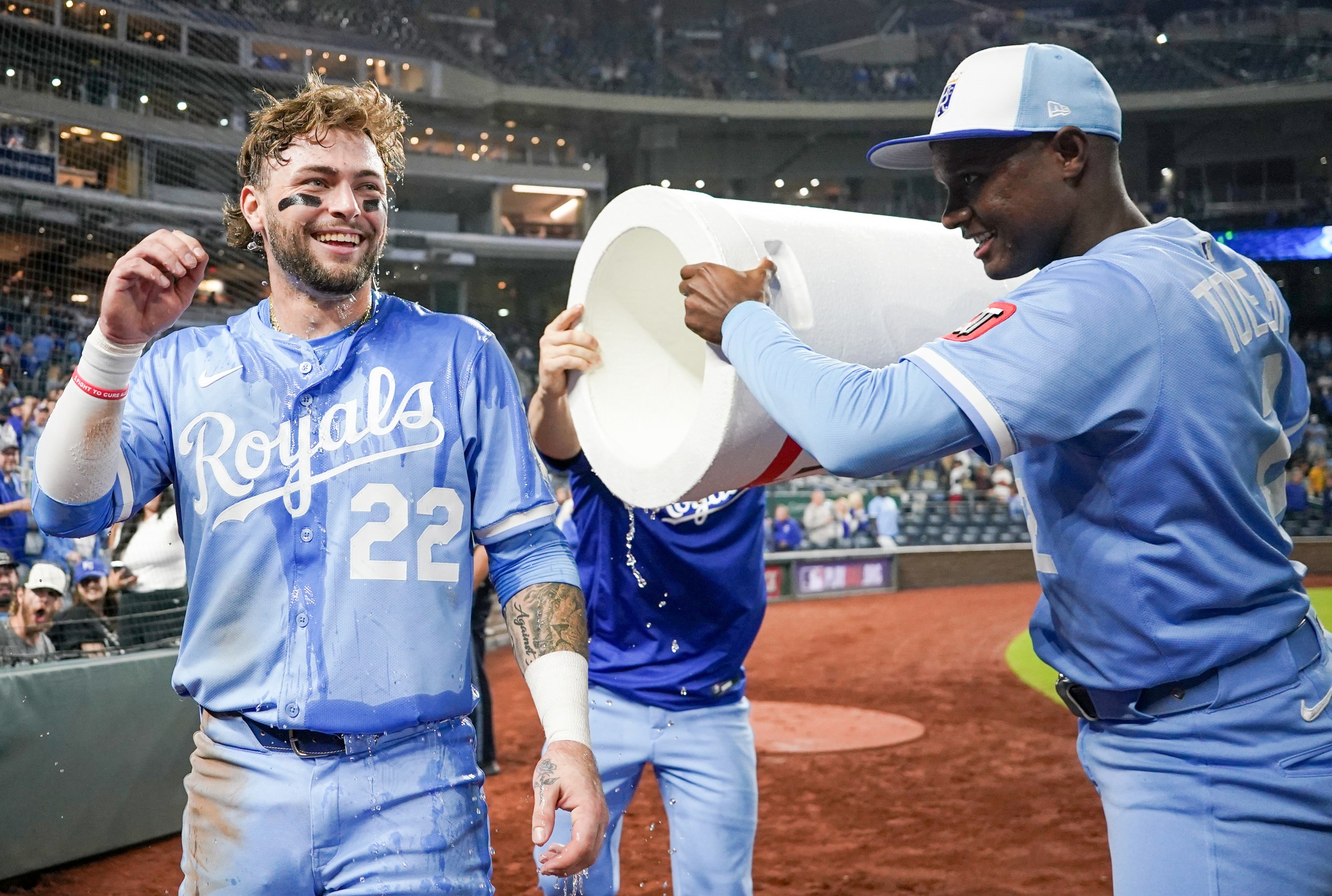 Sep 6, 2025; Kansas City, Missouri, USA; Kansas City Royals designated hitter Carter Jensen (22) is doused by second baseman Tyler Tolbert (2) and center fielder Kyle Isbel (28) after the win over the Minnesota Twins at Kauffman Stadium. Mandatory Credit: Denny Medley-Imagn Images