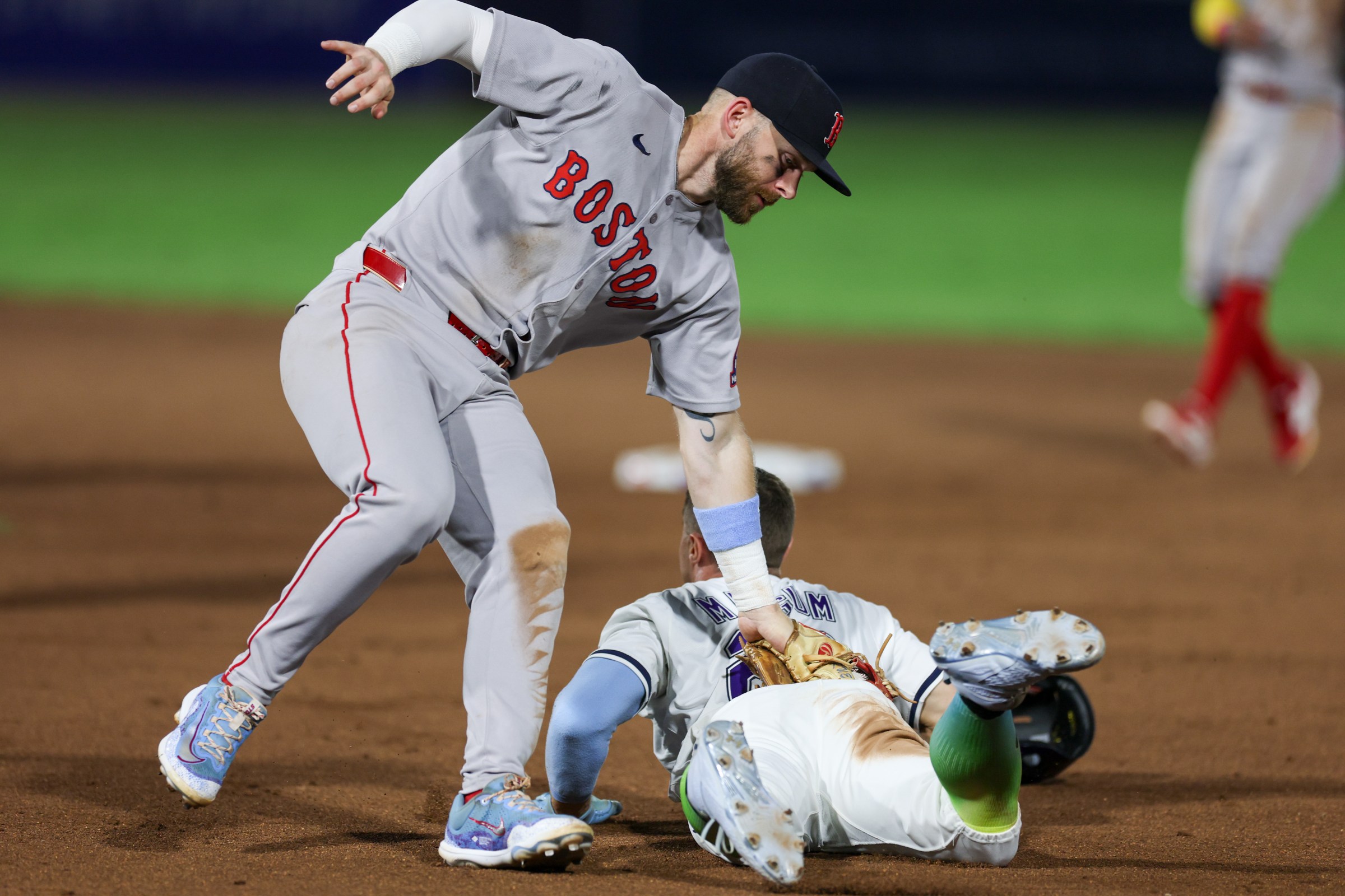 Sep 20, 2025; Tampa, Florida, USA; Boston Red Sox shortstop Trevor Story (10) catches Tampa Bay Rays left fielder Jake Mangum (28) in a run down in the eighth inning at George M. Steinbrenner Field. Mandatory Credit: Nathan Ray Seebeck-Imagn Images