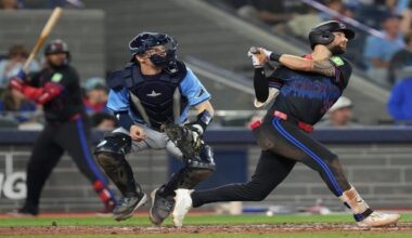 Toronto Blue Jays' Nathan Lukes (38) hits a two-run home run off Tampa Bay Rays pitcher Adrian Houser as Rays catcher Hunter Feduccia (30) looks on during fifth inning MLB baseball action in Toronto on Friday, Sept. 26, 2025. (Chris Young/The Canadian Press via AP)