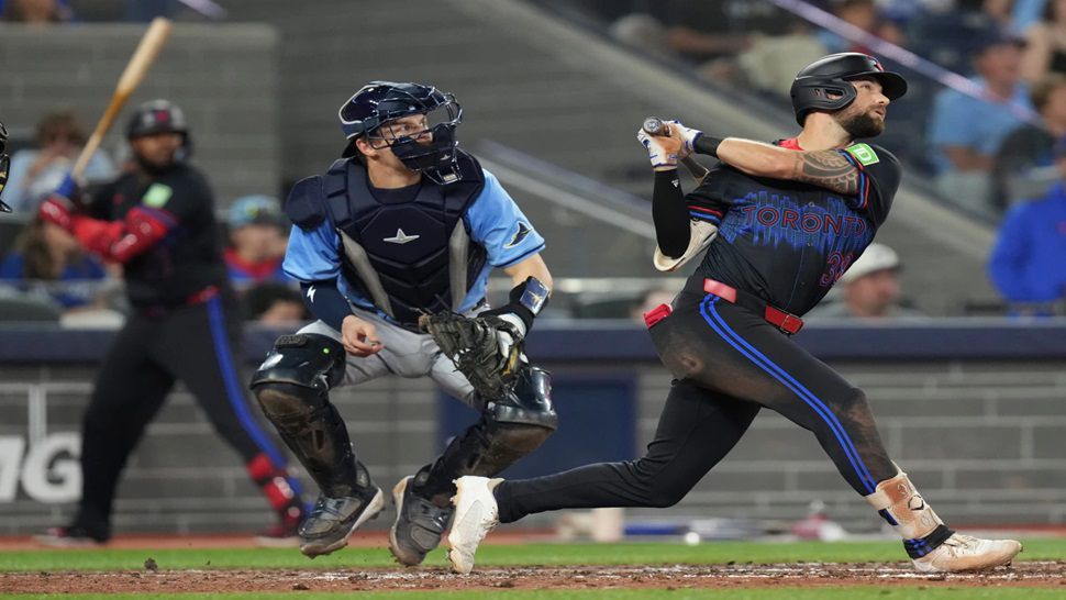 Toronto Blue Jays' Nathan Lukes (38) hits a two-run home run off Tampa Bay Rays pitcher Adrian Houser as Rays catcher Hunter Feduccia (30) looks on during fifth inning MLB baseball action in Toronto on Friday, Sept. 26, 2025. (Chris Young/The Canadian Press via AP)