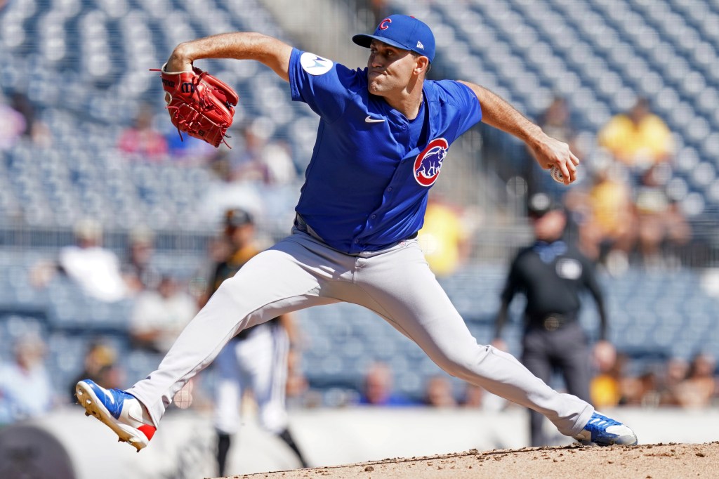 Cubs pitcher in mid-throw.