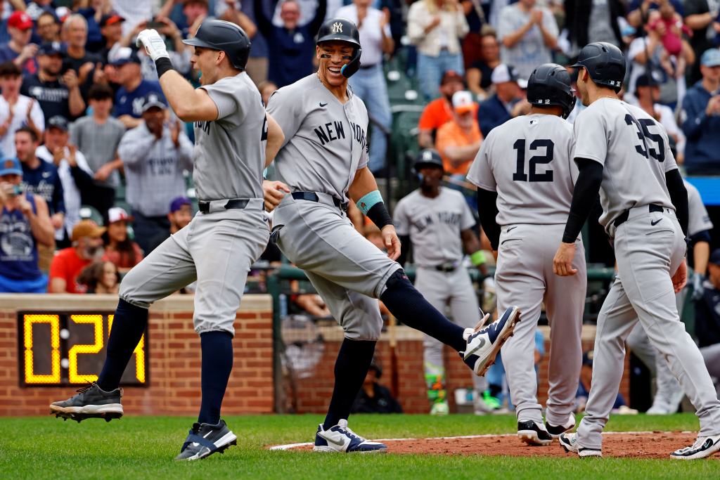 New York Yankees' Ben Rice celebrates his grand slam with Aaron Judge.