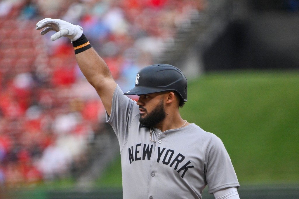 Jasson Dominguez of the New York Yankees celebrates after hitting a single.