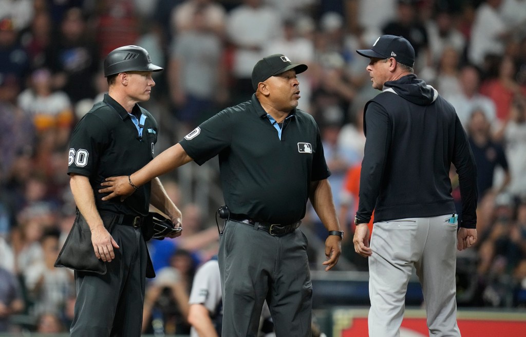 Aaron Boone arguing with umpires Brian Walsh and Adrian Johnson.