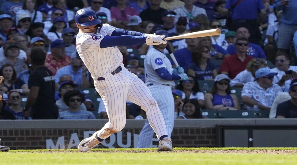 Chicago Cubs' Nico Hoerner hits a two-run double against the Tampa Bay Rays during the seventh inning of a baseball game Sunday, Sept. 14, 2025, in Chicago. (AP Photo/David Banks)