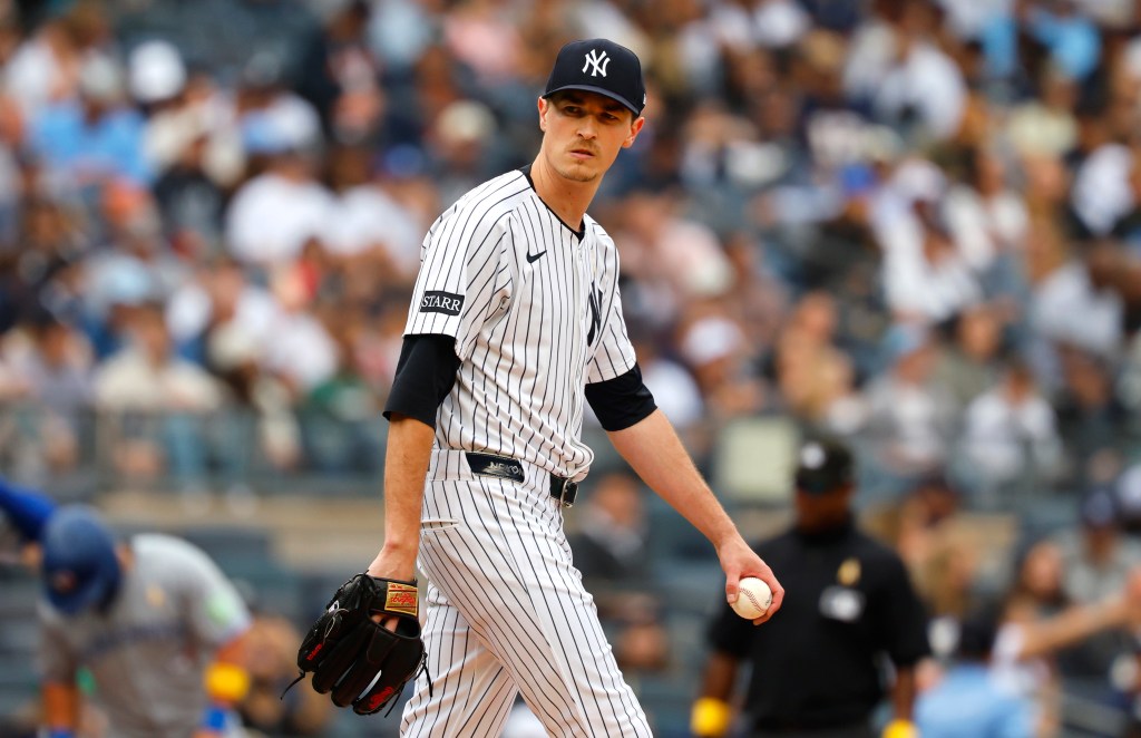 New York Yankees pitcher Max Fried (54) pauses before pitching against the Toronto Blue Jays.