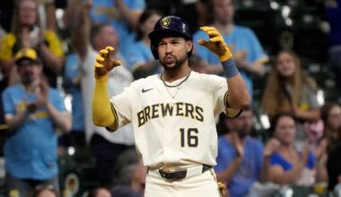 Milwaukee Brewers' Blake Perkins reacts after hitting a three-run scoring triple during the eighth inning of a baseball game against the Los Angeles Angels Wednesday, Sept. 17, 2025, in Milwaukee.