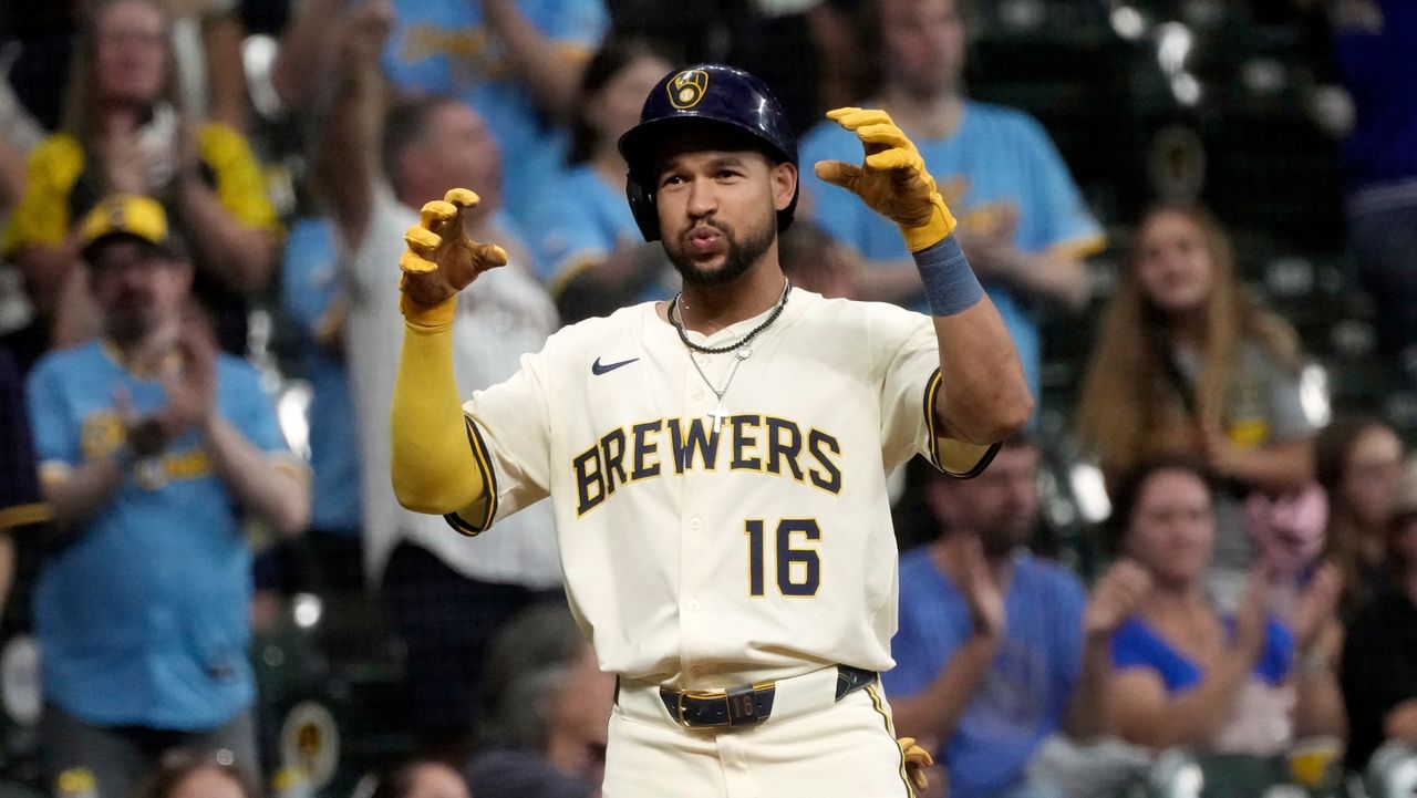 Milwaukee Brewers' Blake Perkins reacts after hitting a three-run scoring triple during the eighth inning of a baseball game against the Los Angeles Angels Wednesday, Sept. 17, 2025, in Milwaukee.