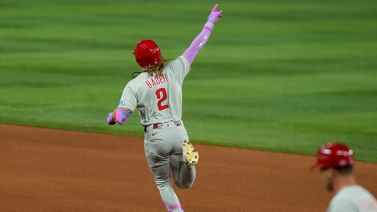Harrison Bader gestures to the bullpen
